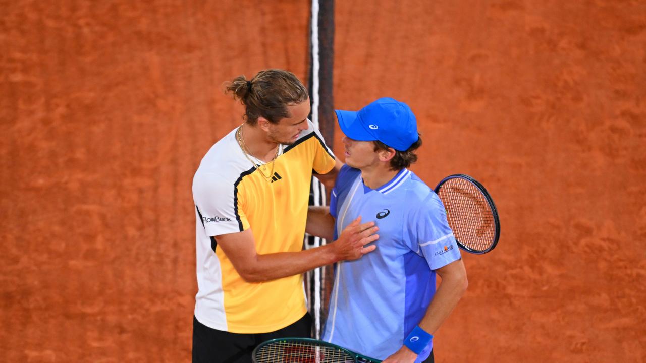 Alexander Zverev embraces Alex De Minaur. Photo by Tim Goode/Getty Images.