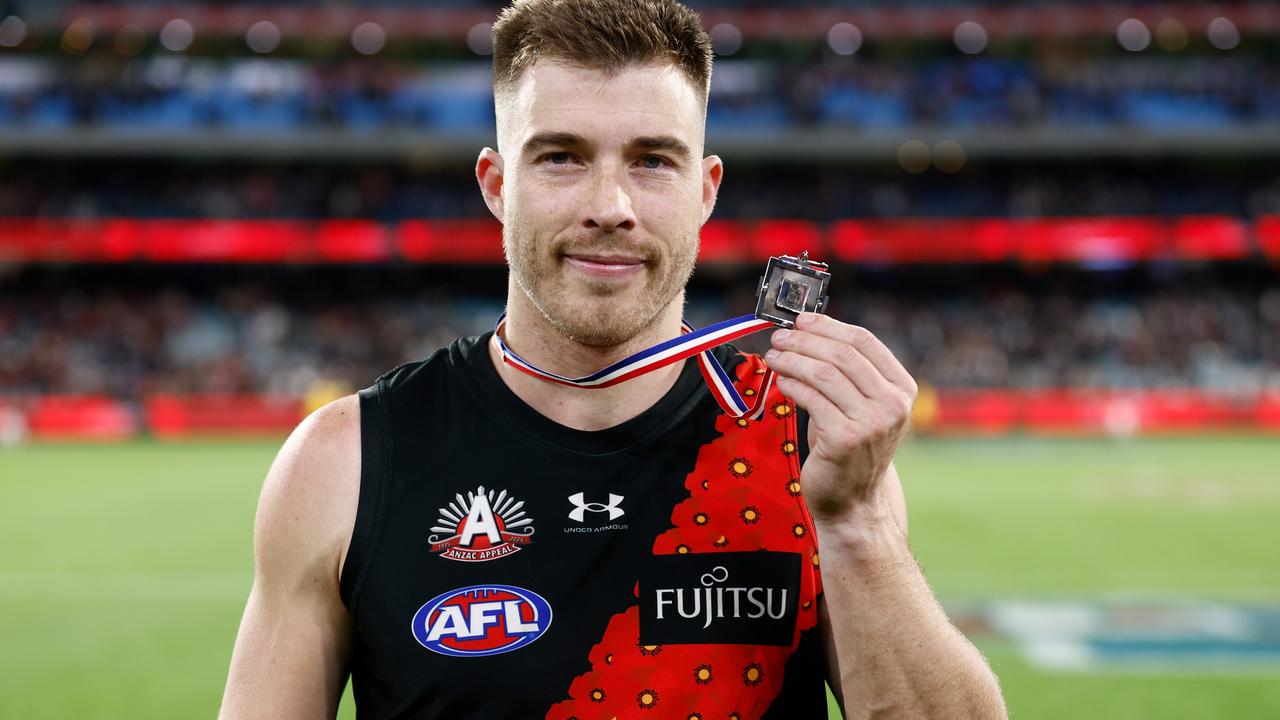 Zach Merrett of the Bombers poses with the Anzac Medal. Photo by Michael Willson/AFL Photos via Getty Images.