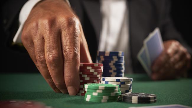 card player gambling casino chips on green felt background selective focus