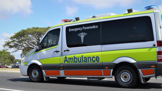 Person hospitalised after car crashes through fence