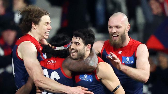 2022 AFL Football Round 22 - Melbourne Demons V Carlton Blues at the MCG. Ben Brown of the Demons, Kysaiah Pickett of the Demons, Christian Petracca of the Demons and Max Gawn of the Demons celebrate on the siren. Picture: Mark Stewart