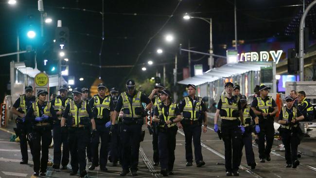 Police on corner Flinders St and Swanston St last night. Picture: Yuri Kouzmin