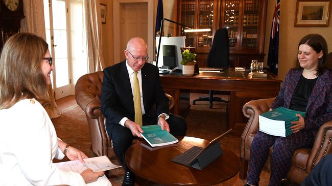 Governor General David Hurley recieves the final report of The Royal Commission into Aged Care Quality and Safety from Commisioner Lynelle Briggs (left) and Acting Official Secretary Sara Samios.