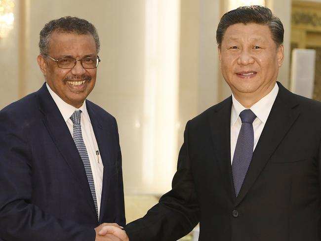 World Health Organization director general Tedros Adhanom (L) shakes hands with Chinese President Xi jinping before a meeting at the Great Hall of the People in Beijing on January 28, 2020. - China urged its citizens to postpone travel abroad as it expanded unprecedented efforts to contain a viral outbreak that has killed 106 people and left other governments racing to pull their nationals from the contagion's epicentre. (Photo by Naohiko Hatta / AFP)