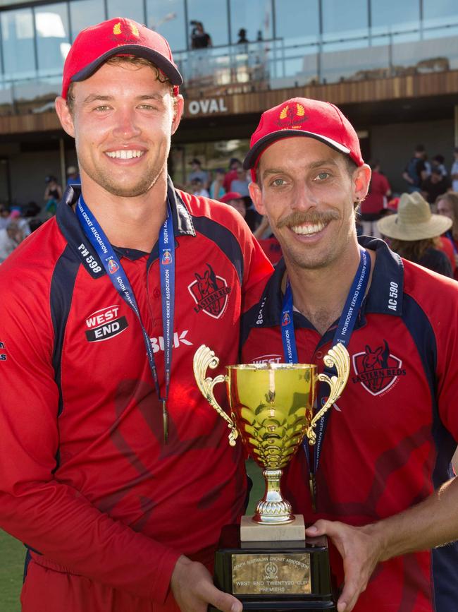 East Torrens' Luke Robins and Jake Lehmann with last season’s premier cricket T20 trophy.