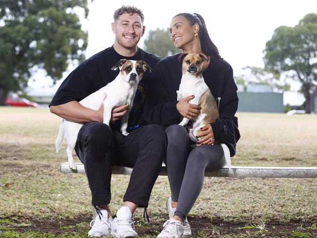 For so many Aussies, pets are party of the family. Bulldogs NRL player Max King and his fiancee Christy Young with their dogs Bella and Bowsi. Picture: Richard Dobson