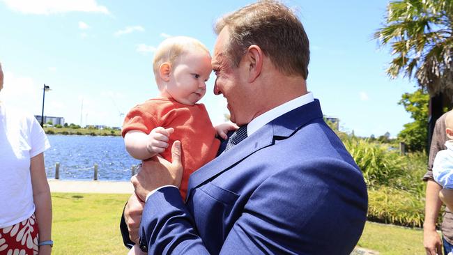 Steven Miles posing with a baby. Pic: Adam Head