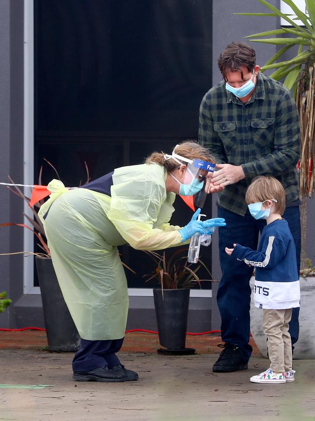 A medical worker tests a child at Epichealth Ocean Grove.