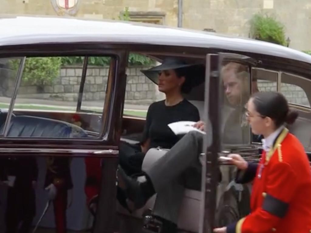 Prince Harry puffs out his cheeks as he gets into car with Meghan as King Charles and family leave St George’s Chapel before heading to the private service. Picture: BBC