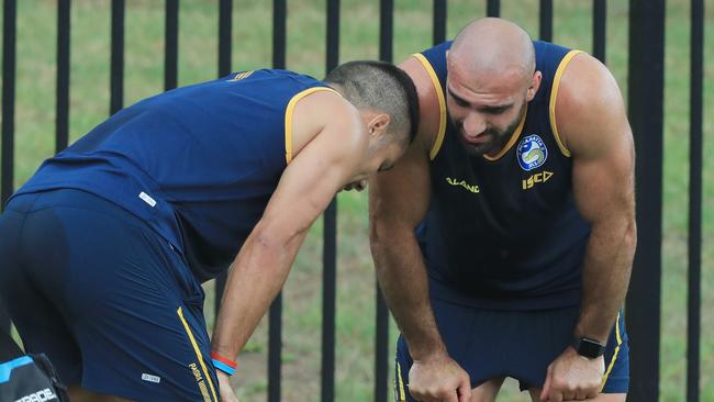 Jarryd Hayne gets encouragement from Tim Mannah at pre-season training.