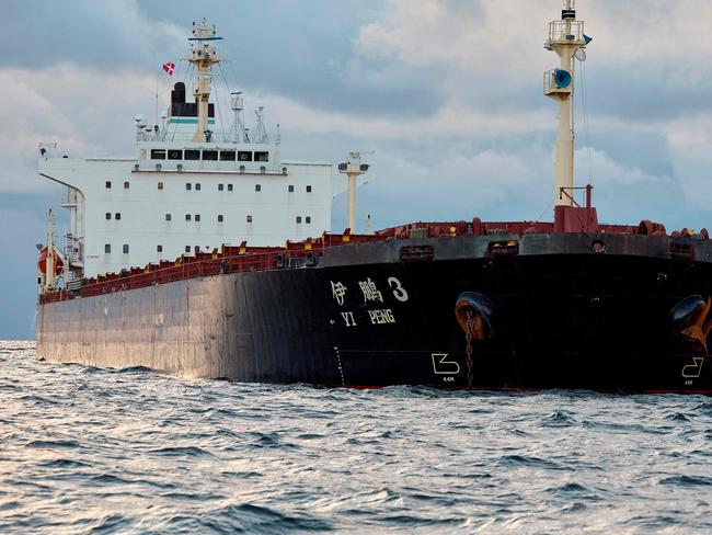 The Chinese ship, the bulk carrier Yi Peng 3 is anchored and being monitored by a Danish naval patrol vessel (unseen) in the sea of Kattegat, near the City og Granaa in Jutland, Denmark, on November 20, 2024. Denmark's navy said on November 20, 2024 it was shadowing a Chinese cargo vessel in the Baltic Sea, a day after Finland and Sweden opened investigations into suspected sabotage of two severed undersea telecoms cables. "The Danish Defence can confirm that we are present in the area near the Chinese ship Yi Peng 3," the military wrote in an email to AFP, adding that it would make no further comment for the time-being. (Photo by Mikkel Berg Pedersen / Ritzau Scanpix / AFP) / Denmark OUT