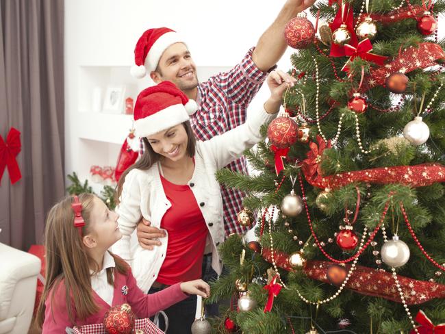 Family decorating christmas tree. Picture: istock