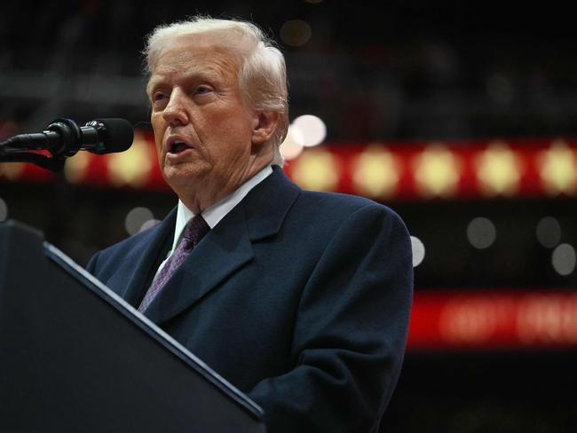 US President Donald Trump speaks during the inaugural parade inside Capital One Arena, in Washington, DC, on January 20, 2025. (Photo by Jim WATSON / AFP)