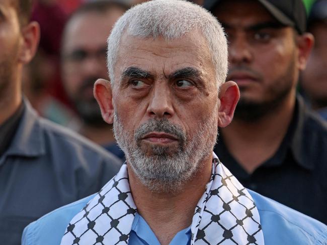 (FILES) Head of the political wing of the Palestinian Hamas movement in the Gaza Strip Yahya Sinwar attends a rally in support of Jerusalem's al-Aqsa mosque in Gaza City on October 1, 2022. After a career in the shadows, spent in Israeli prisons and the internal security apparatus of Hamas, Yahya Sinwar rose to lead the Islamist movement in the Gaza Strip. He stands accused of masterminding the group's October 7 attacks, the worst in Israel's history, which officials say left around 1,200 people dead and about 240 dragged back to Gaza as hostages. (Photo by MAHMUD HAMS / AFP)