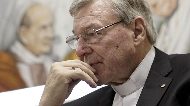 Cardinal George Pell attends a press conference at the Vatican Radio headquarters, in Rome, Tuesday, March 31, 2015. The Vatican finance minister has said he hopes to avoid financial scandal with the upcoming Jubilee year, saying the plans will be subject to new Vatican procedures to ensure they follow international standards for transparency and accountability. Cardinal George Pell outlined the Vatican's financial reform during a conference Tuesday to launch a book on better managing church assets, a priority for Pope Francis after years of financial scandal and mismanagement at the Holy See. (AP Photo/Andrew Medichini)
