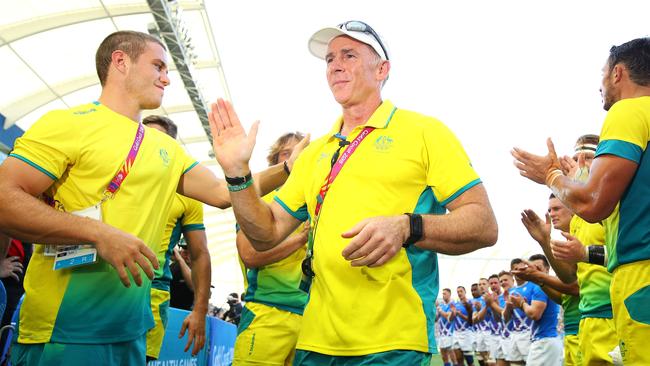 Australia coach Andy Friend is applauded from the field after coaching the men’s sevens team for the last time. Picture: Getty Images