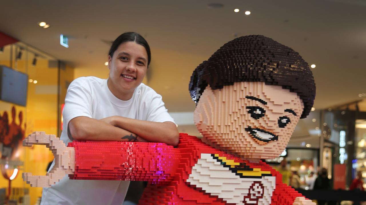 Sam Kerr poses with her life-size LEGO mini-figure Picture: Supplied