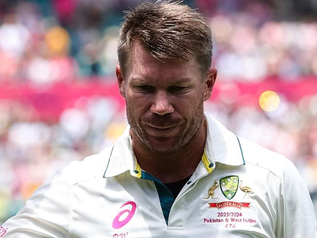 SYDNEY, AUSTRALIA - JANUARY 06: David Warner of Australia raises his bat to the crowd after getting out in his last test match during Day 4 of the third test match between Australia and Pakistan at the Sydney Cricket Ground on January 06, 2024 in Sydney, Australia. (Photo by Pete Dovgan/Speed Media/Icon Sportswire via Getty Images)