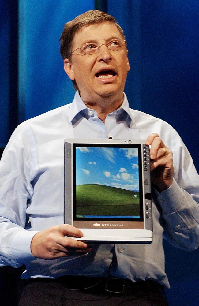 Then-Microsoft Corporation chairman Bill Gates holding a tablet in 2002. Picture: AFP