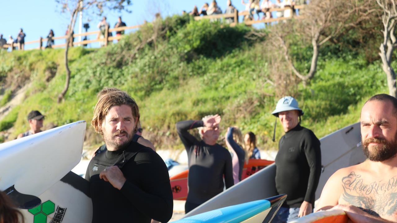 Members of the public took part in a paddle-out at Byron Bay's Main Beach to protest against the planned Netflix reality show Byron Baes on the morning of Tuesday, April 20, 2021. Picture: Liana Boss