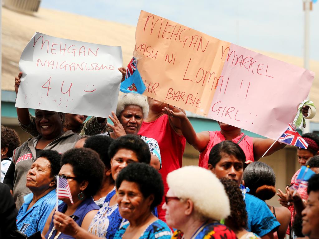 Fijian women on the streets hold up placards welcoming the Duchess. Picture: Nathan Edwards