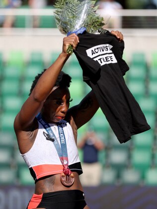 Gwen Berry displays an Activist Athlete shirt during the national anthem after placing third in the Women's Hammer Throw at the US Olympic trials. Photo by Patrick Smith/Getty Images