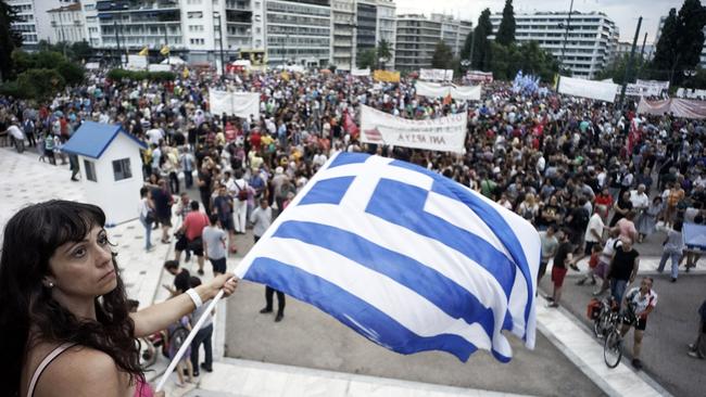 Protesters attend an anti-austerity pro-government rally in front of the parliament building. Greece's left wing government believes it can reach a deal with its creditors on Monday.