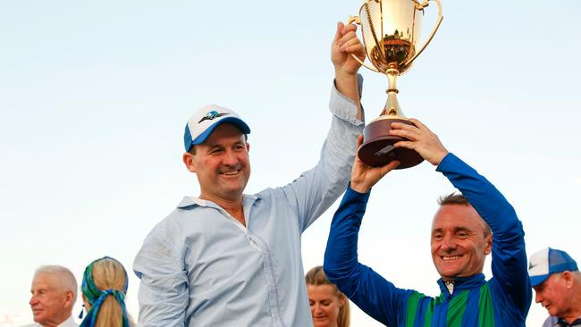 Ihtsahymn, ridden by Peter Hall (right) and trained by Robert Gilbert (left), wins the 2019 Great Northern Darwin Cup. Picture: Glenn Campbell