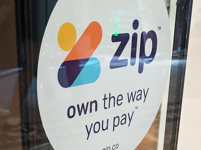 **FILE IMAGE**  Zip signage is seen on a storefront in Sydney, Tuesday, October 22, 2019. By the end of December 2019, 1.8 million customers had an active Zip account that allows them buy now and pay later without a credit card at 20,875 merchants, including Amazon Australia. (AAP Image/Derek Rose) NO ARCHIVING