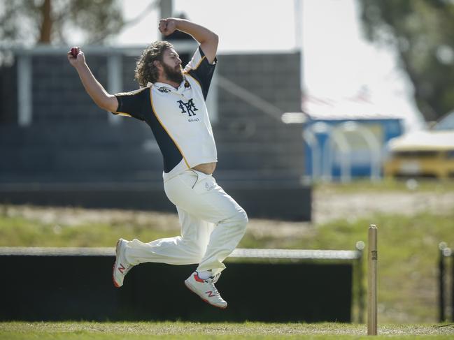 Main Ridge bowler Luke Collins goes at Long Island. Picture: Valeriu Campan