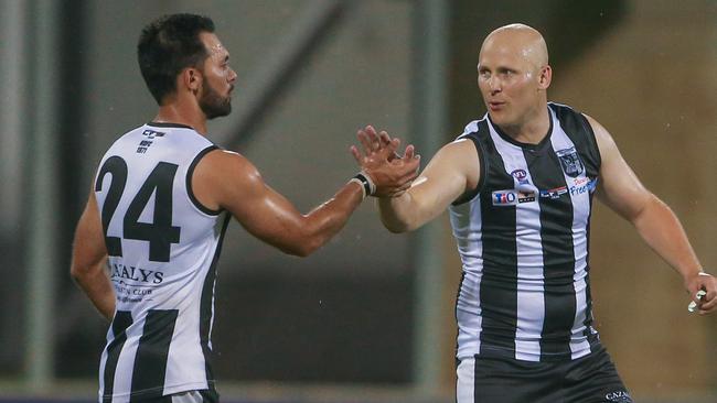 Gary Ablett Jr shares some wisdom with Brodie McMahon as Palmerston take on St Mary’s. Picture: Glenn Campbell