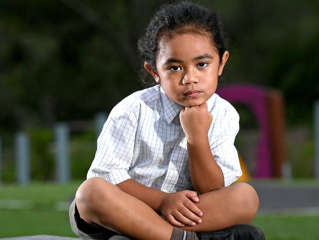 Wendy Taniela with her 5 year old son Cyrus Taniela in a play ground in Upper Caboolture.The mother of a five-year-old boy with long hair says his Caboolture school, Australian Christian College Moreton, told them it had to be cut despite his hair cutting ceremony, which is part of his father’s Cook Islands and Niuean heritage, being still a year awayMonday February 10,2020. (AAP image, John Gass)