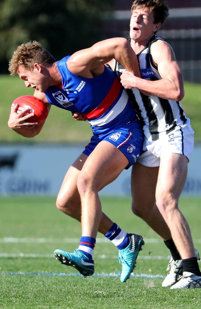 Callan Wellings tackles Bulldog Mitch Wallis.