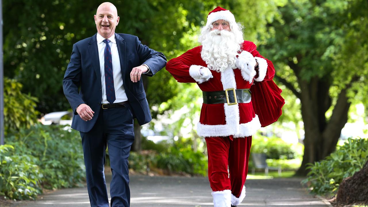 Tasmanian Premier Peter Gutwein with Santa to talk about having a COVID-safe Christmas. The state has issued Santa an essential-worker exemption so he can travel to do his job and put in place a COVID safety plan for Santa and his reindeer. Picture: Zak Simmonds