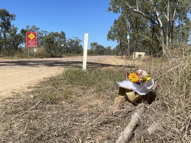 Flowers were left on the roadside near the property where the fatal shooting occurred. Picture: DANIEL SHIRKIE