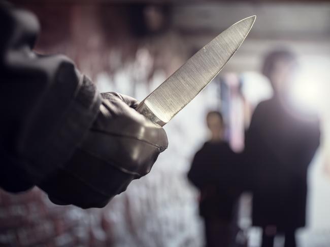 Generic crime Istock  -  Criminal with knife weapon threatening woman and child in underpass crime