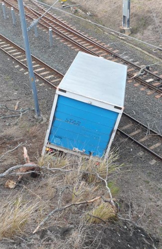 Truck going onto train tracks near Manly Station.