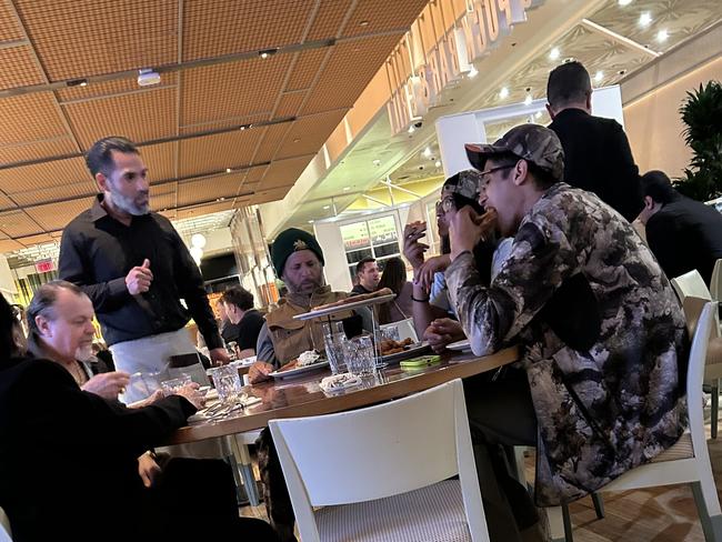 Sebastian Fundora eating pizza with his family three days before his world title fight against Tim Tszyu.