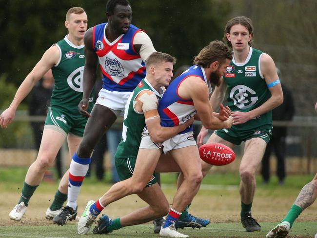 NFL: North Heidelberg’s Jesse Tardio tackled by Jackson Hasler of Greensborough. Picture: Hamish Blair