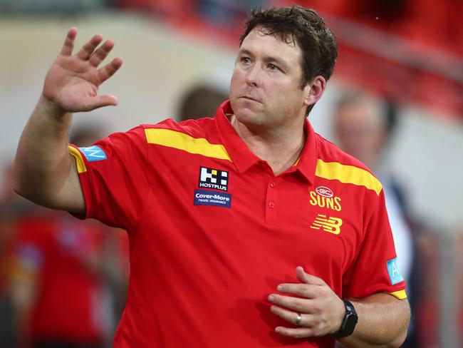 GOLD COAST, AUSTRALIA - MARCH 27: Suns coach Stuart Dew celebrates winning the round 2 AFL match between the Gold Coast Suns and the North Melbourne Kangaroos at Metricon Stadium on March 27, 2021 in Gold Coast, Australia. (Photo by Chris Hyde/Getty Images)