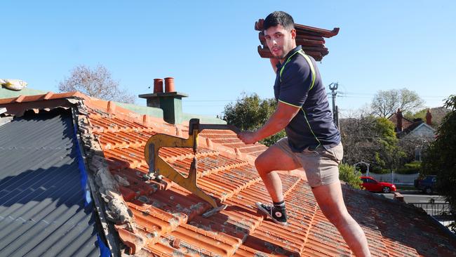 Roof tiler Ben Arias has turned a career as a roof tiler into a way to boost his prospects of putting a roof over his own head. Picture: David Crosling.