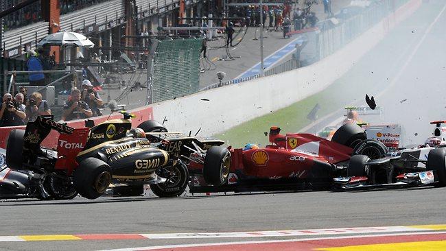 Lotus F1 Team's French driver Romain Grosjean, and Ferrari's Spanish driver Fernando Alonso crash