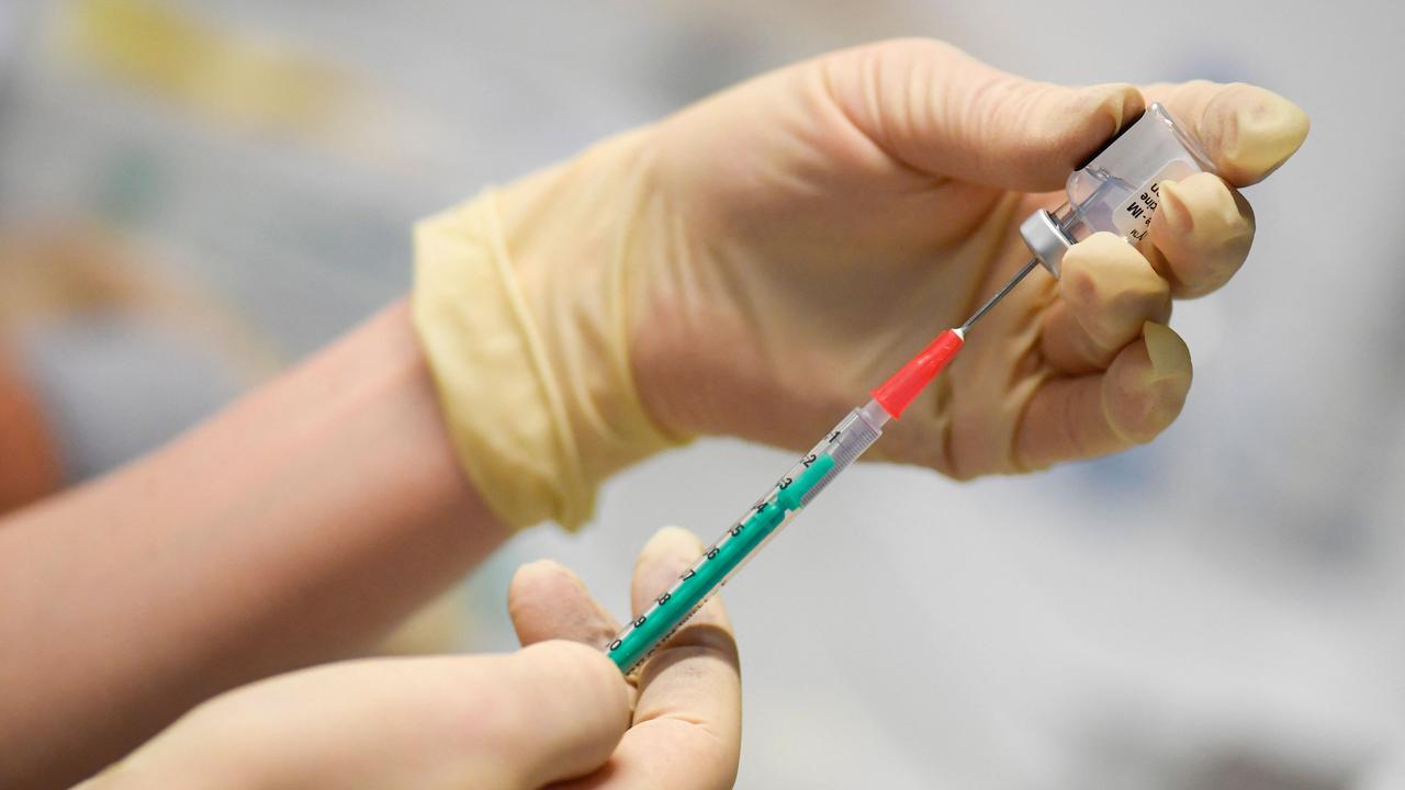 A syringe is filled with the Pfizer vaccine. Picture: Thomas Kienzle/AFP