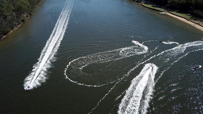 Jetski riders on the Georges River at Revesby Beach. Picture: Jonathan Ng