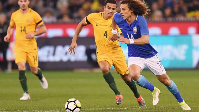 Tim Cahill tackles David Luiz the last time Australia played Brazil in 2017 at the MCG.