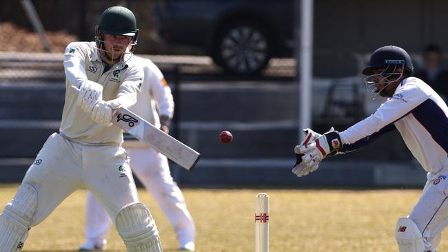 Nick Carlton of Rosanna gets a shot away.Picture: Hamish Blair