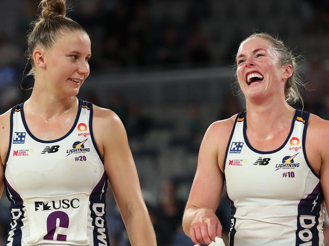 MELBOURNE, AUSTRALIA - MAY 09: Laura Scherian of the Lightning (L) and teammate Mahalia Cassidy share a joke following victory in the round two Super Netball match between Melbourne Vixens and Sunshine Coast Lightning at John Cain Arena, on May 09, 2021, in Melbourne, Australia. (Photo by Graham Denholm/Getty Images)