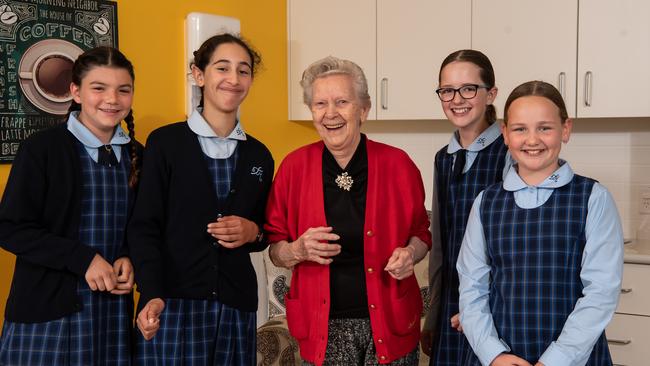 St Andrew's Catholic Primary School Malabar students Olivia McCarthy, Angelina Mansour, resident Elf Frerieda, Emma Sowerby and Eva Ryan at the nursing home in Daceyville. Picture: Monique Harmer