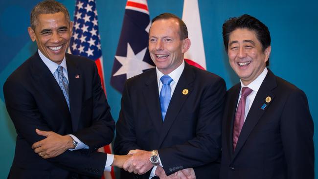 Barack Obama, Tony Abbott and Shinzo Abe shake hands during a trilateral meeting at the G20 Summit in 2014 in Brisbane. Picture: Getty Images