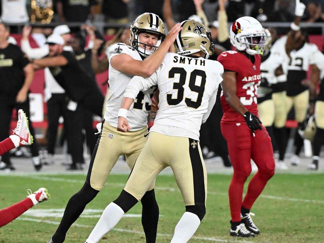 GLENDALE, ARIZONA - AUGUST 10: Charlie Smyth #39 of the New Orleans Saints celebrates with Matthew Hayball #43 after kicking the game winning field goal against the Arizona Cardinals during the fourth quarter of a preseason game at State Farm Stadium on August 10, 2024 in Glendale, Arizona. Saints won 16-14.   Norm Hall/Getty Images/AFP (Photo by Norm Hall / GETTY IMAGES NORTH AMERICA / Getty Images via AFP)